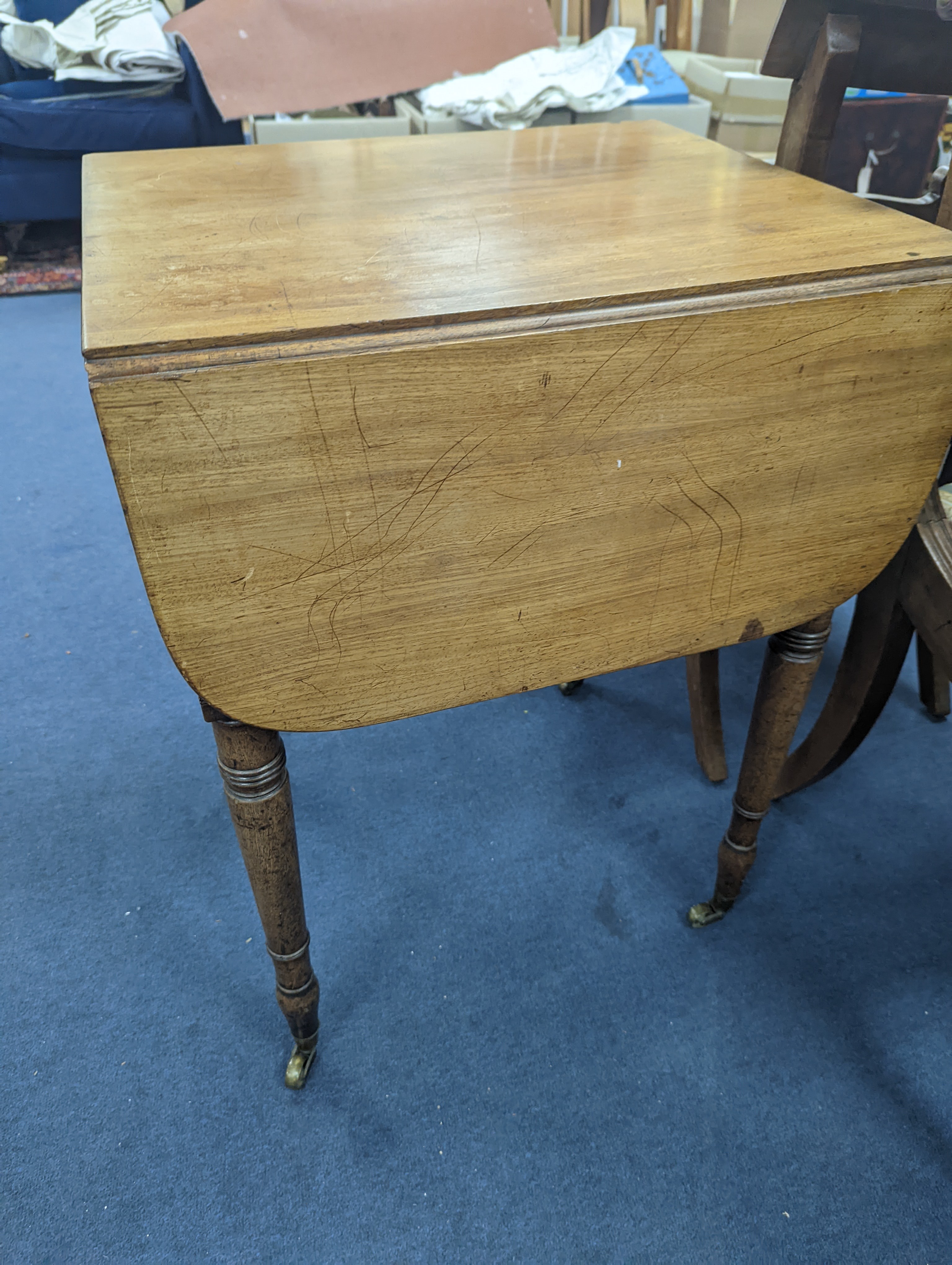 A Regency mahogany drop flap work table with twin fall compartments, width 48cm, depth 54cm, height 71cm